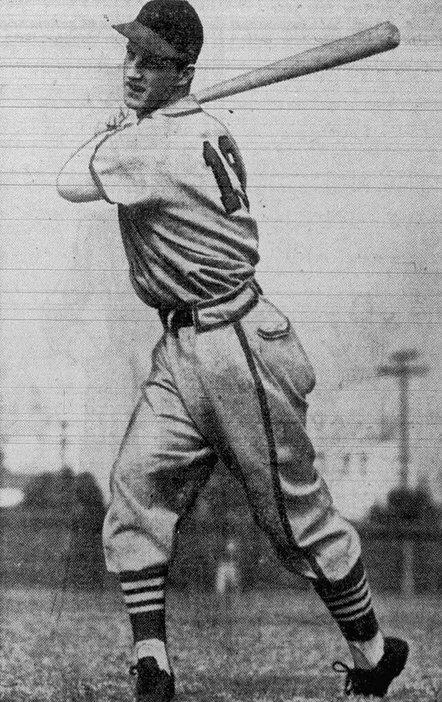 Stan Musial preparing to swing a bat, black and white photo