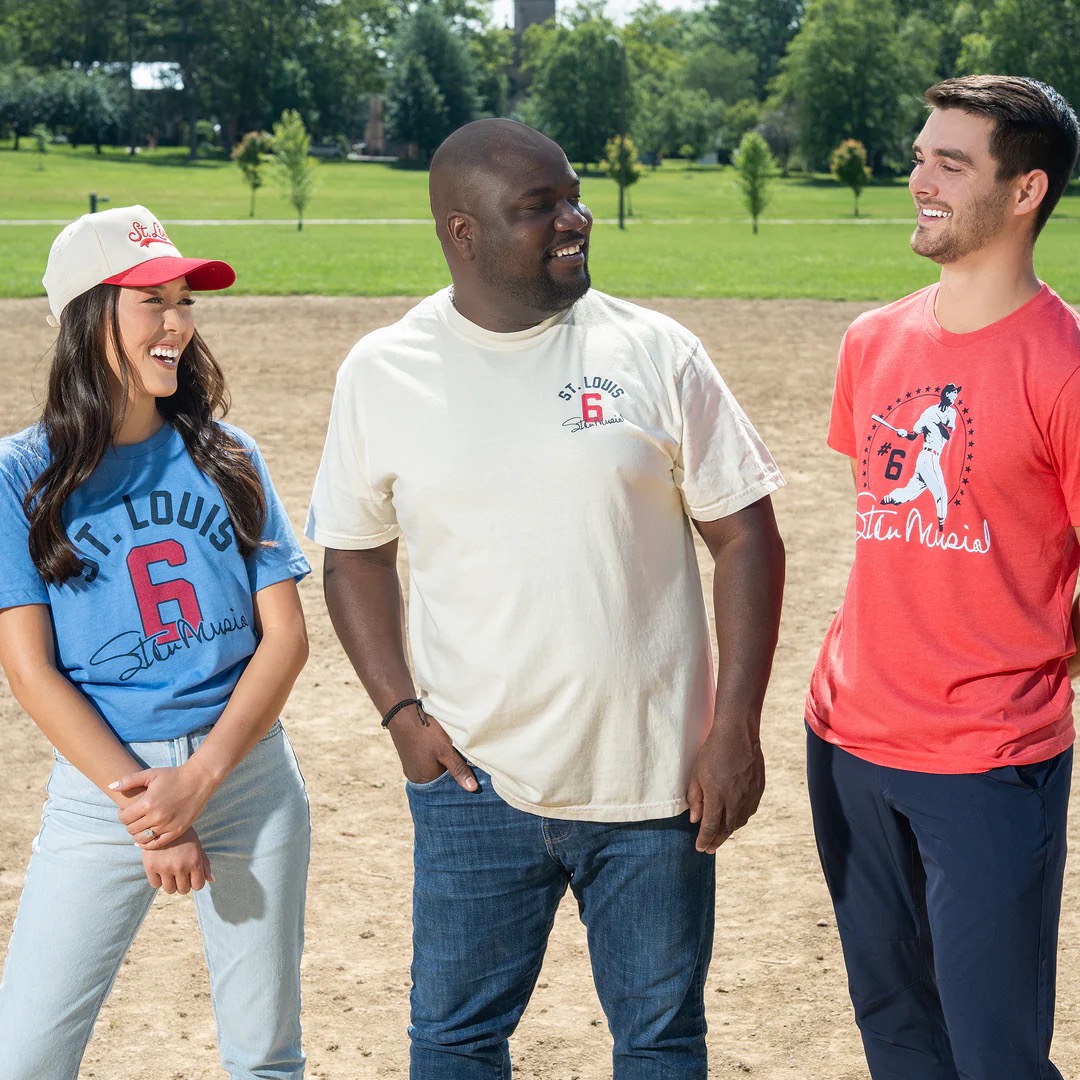 Series Six Stan Musial apparel collaboration with three fans wearing Stan-themed shirts